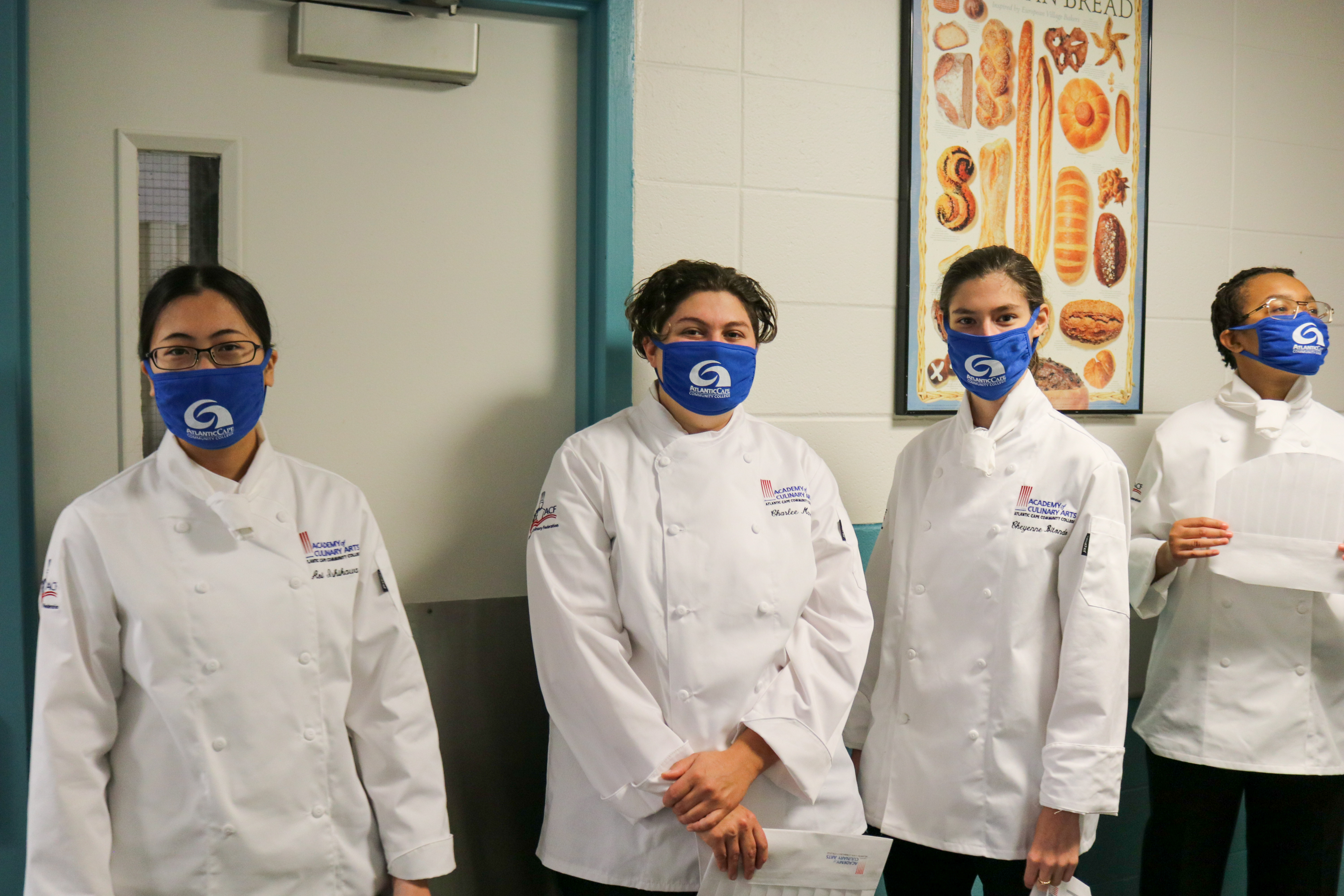Academy of Culinary Arts students lined up in the hallway